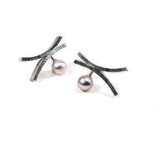 Pearl Silver Cross Stud Earrings featuring a cultured pearl suspended from a textured cross shown on a white background
